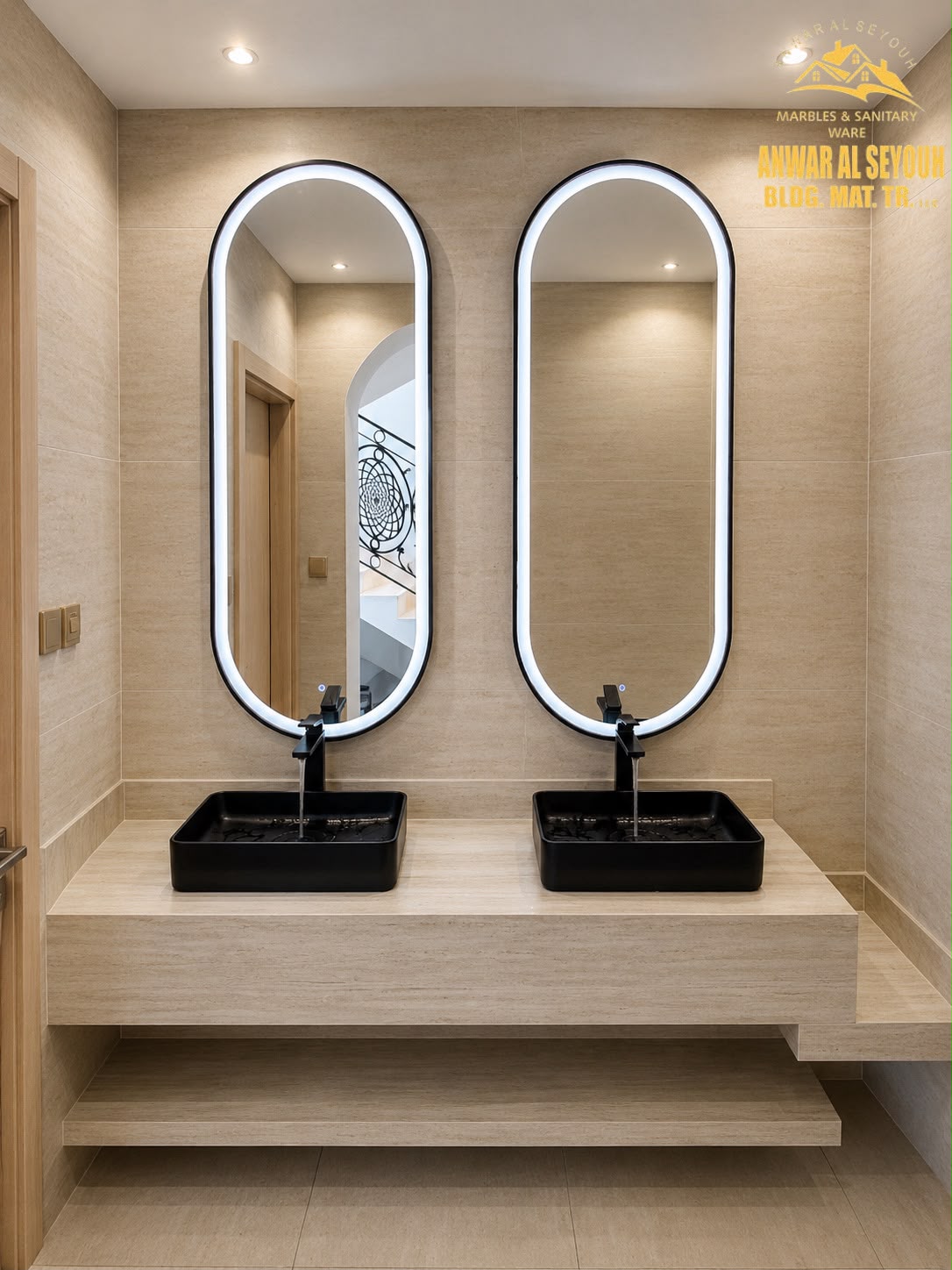 Travertine vanity counter with two black countertop basins and oval LED mirrors in Nad Al Sheba, Dubai